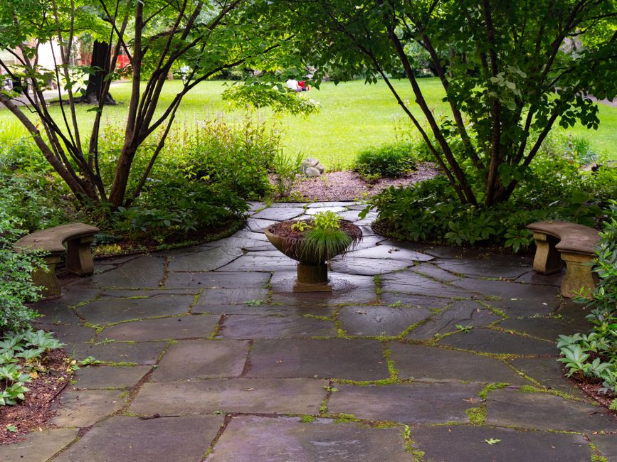 How Do I Fix a Paver Patio That Holds Water or Slopes Toward My House?